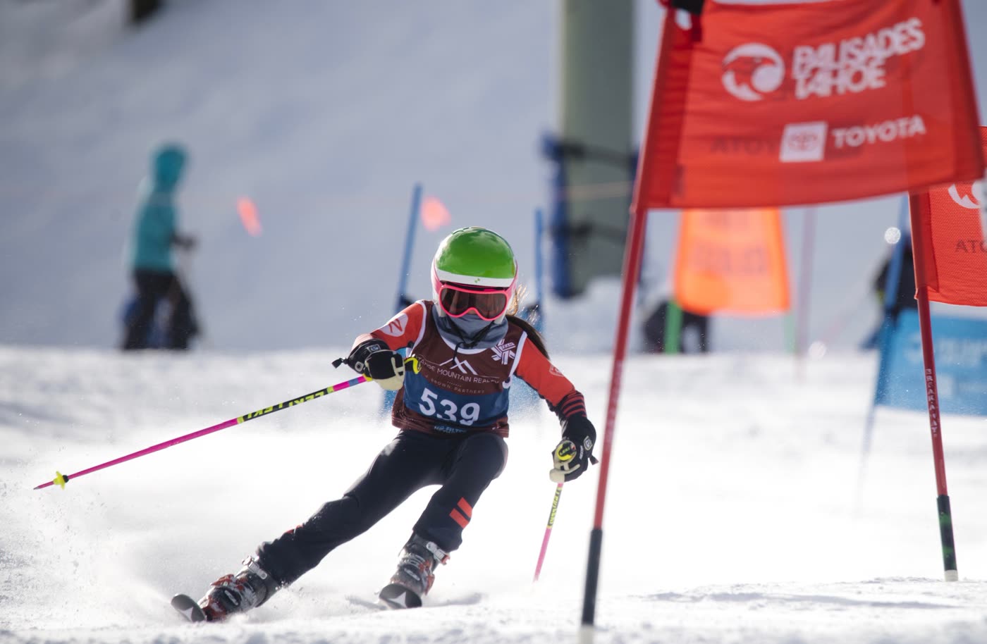 A young racer skiing through the gates