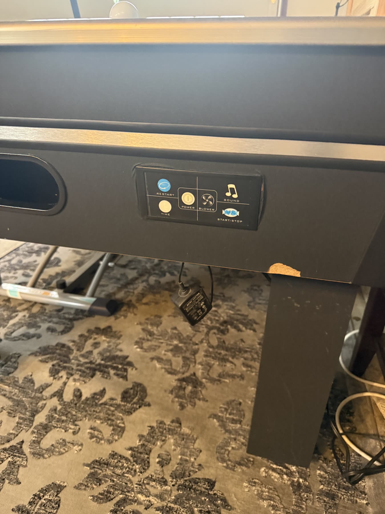 The air hockey table's control buttons