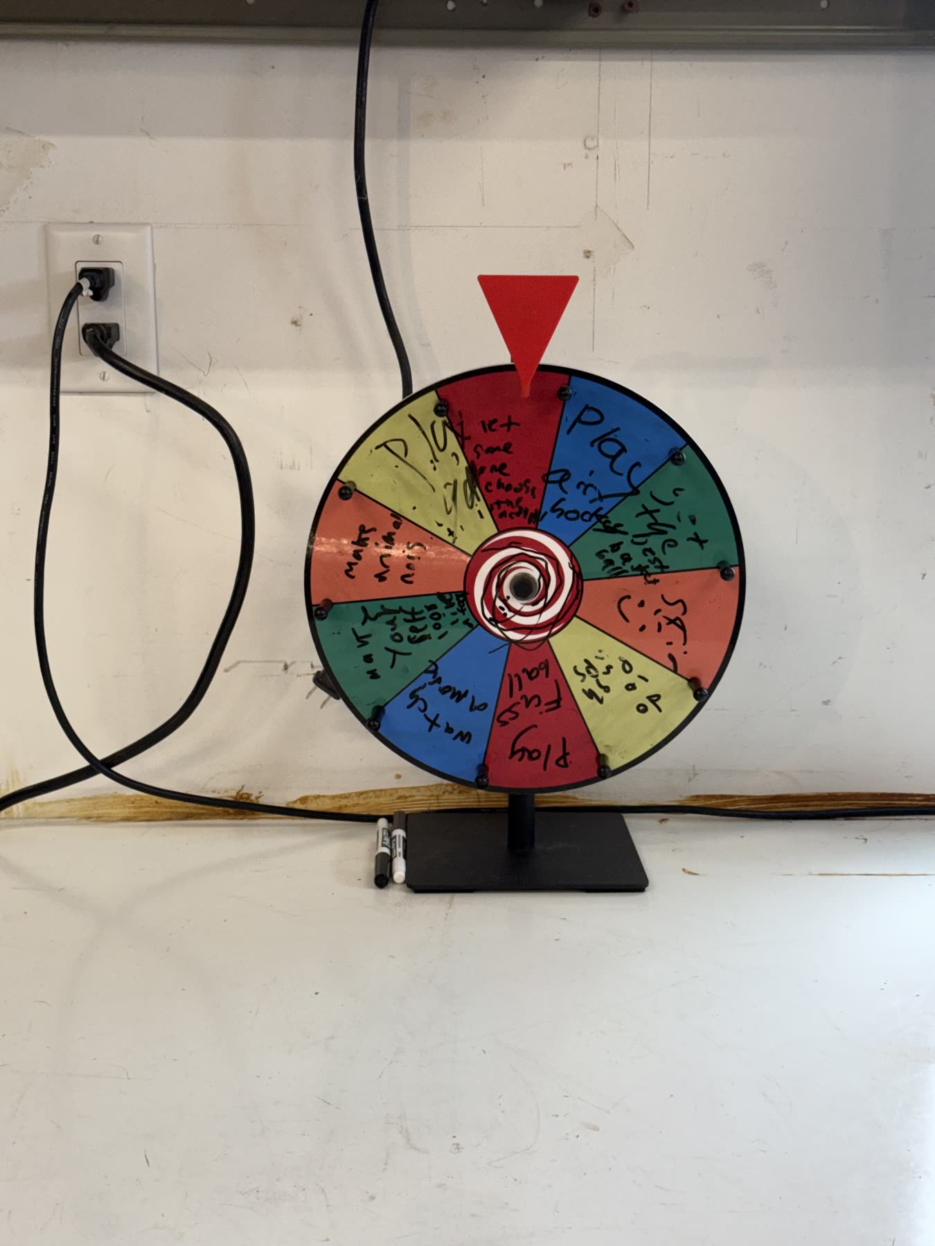 The garage's dry-erase spin wheel with hand-written twists